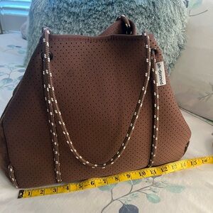 Brown ah-dorned tote